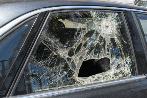 car-side-window-replacement-columbia-sc Badly damaged side window on black car.